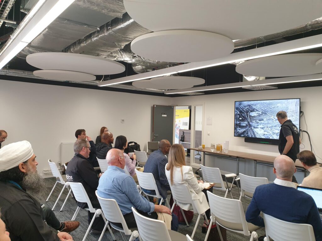 Delegates are seated whilst David Horsfall presents to the room