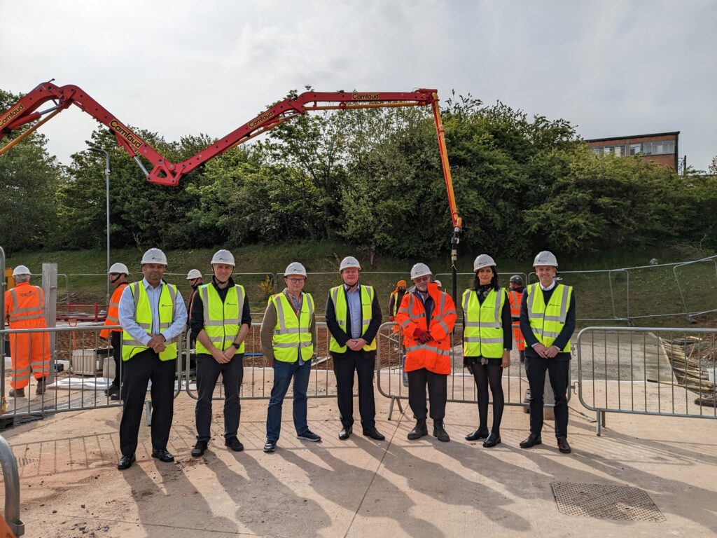 Project partners gather at the construction site